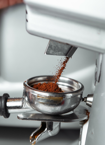 coffee-grinder-grinding-freshly-roasted-make-beans-into-powder_10844070 1 (1)
