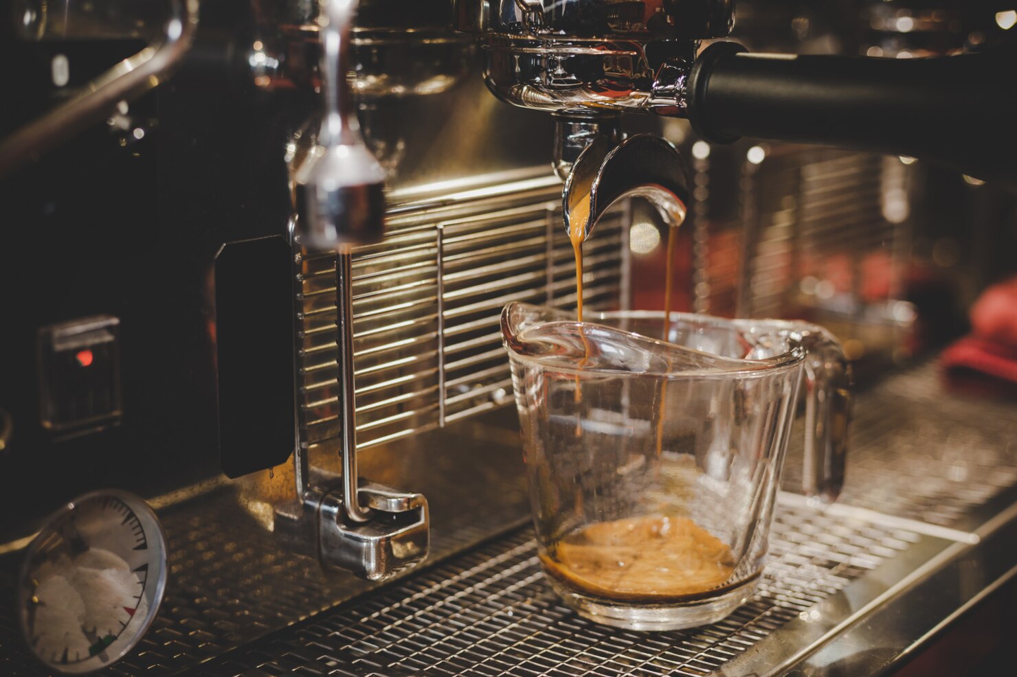 barista-using-coffee-machine-cafe_1150-8038